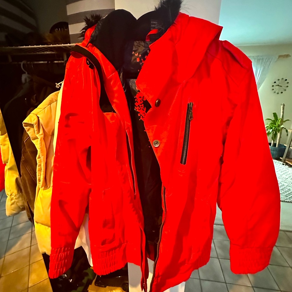 Women’s bright red ski jacket w/ fur hood.